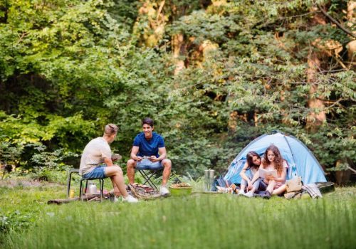 teenagers-camping-in-forest-summer-adventure--e1631464369508-pd0ihi5xoq3evk1mo6f17so91ospi6wnr2jr183a98